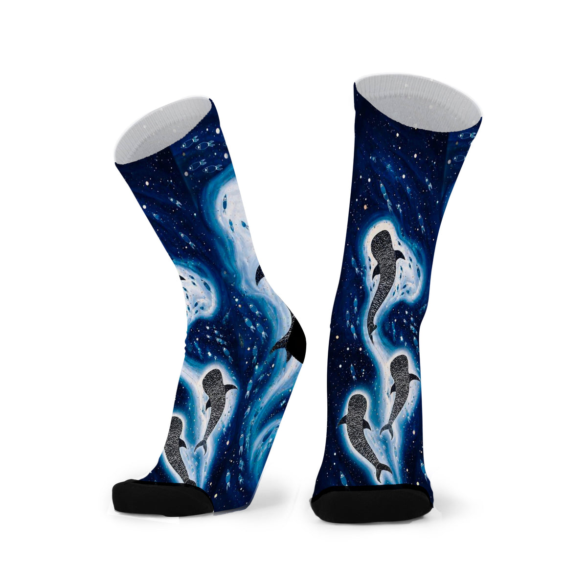 Giants of the Blue by Melanie Hava: pair of navy bamboo socks with whales surrounded by glowing blue ocean patterns.
