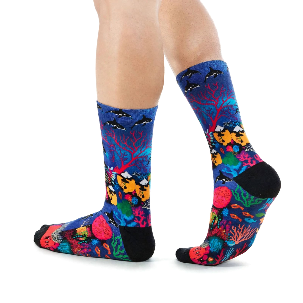 Great Barrier Reef by Melanie Hava: blue fish-and-coral bamboo socks worn on feet, side view.