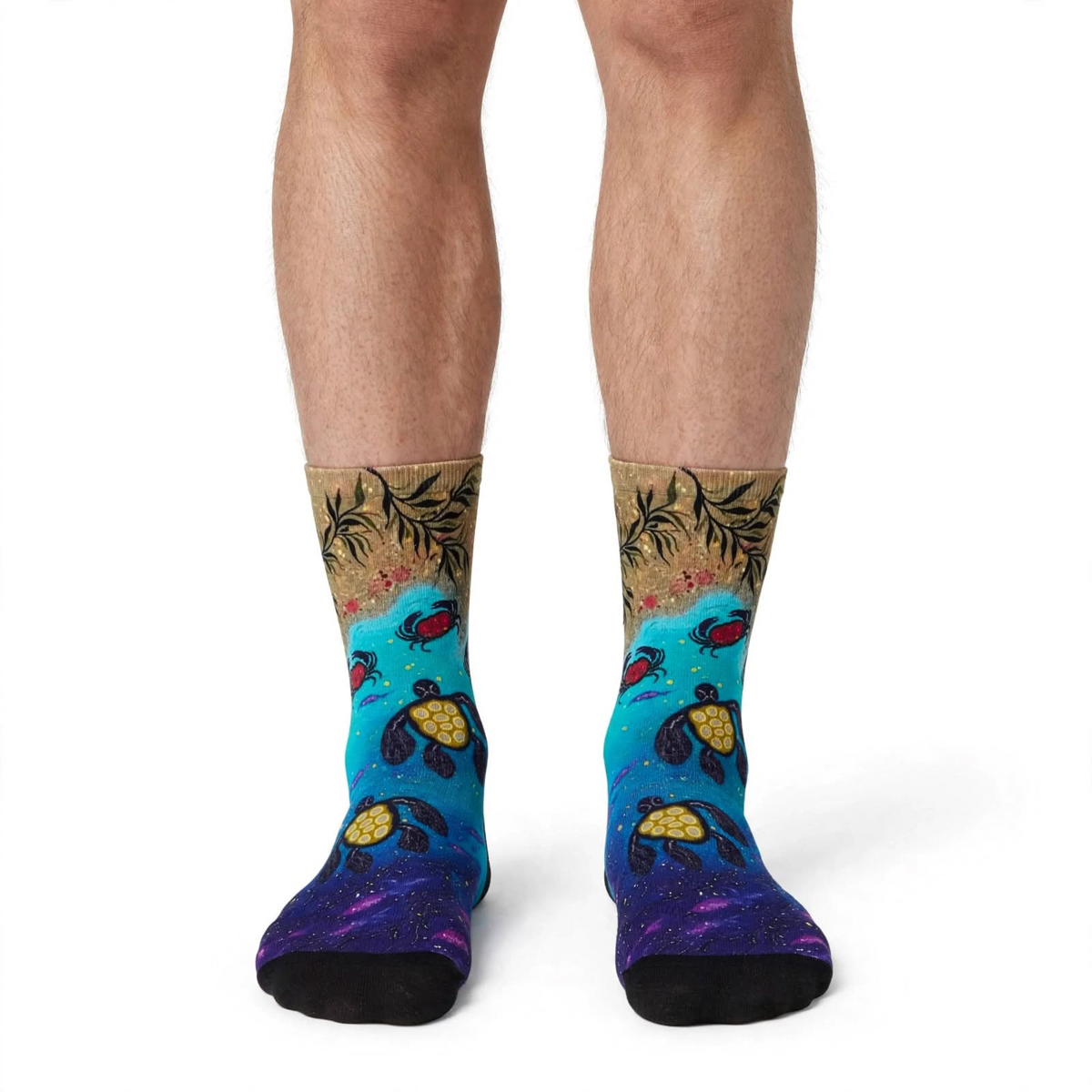 Returning to Shores by Melanie Hava: sea turtle bamboo socks worn on feet, front view.