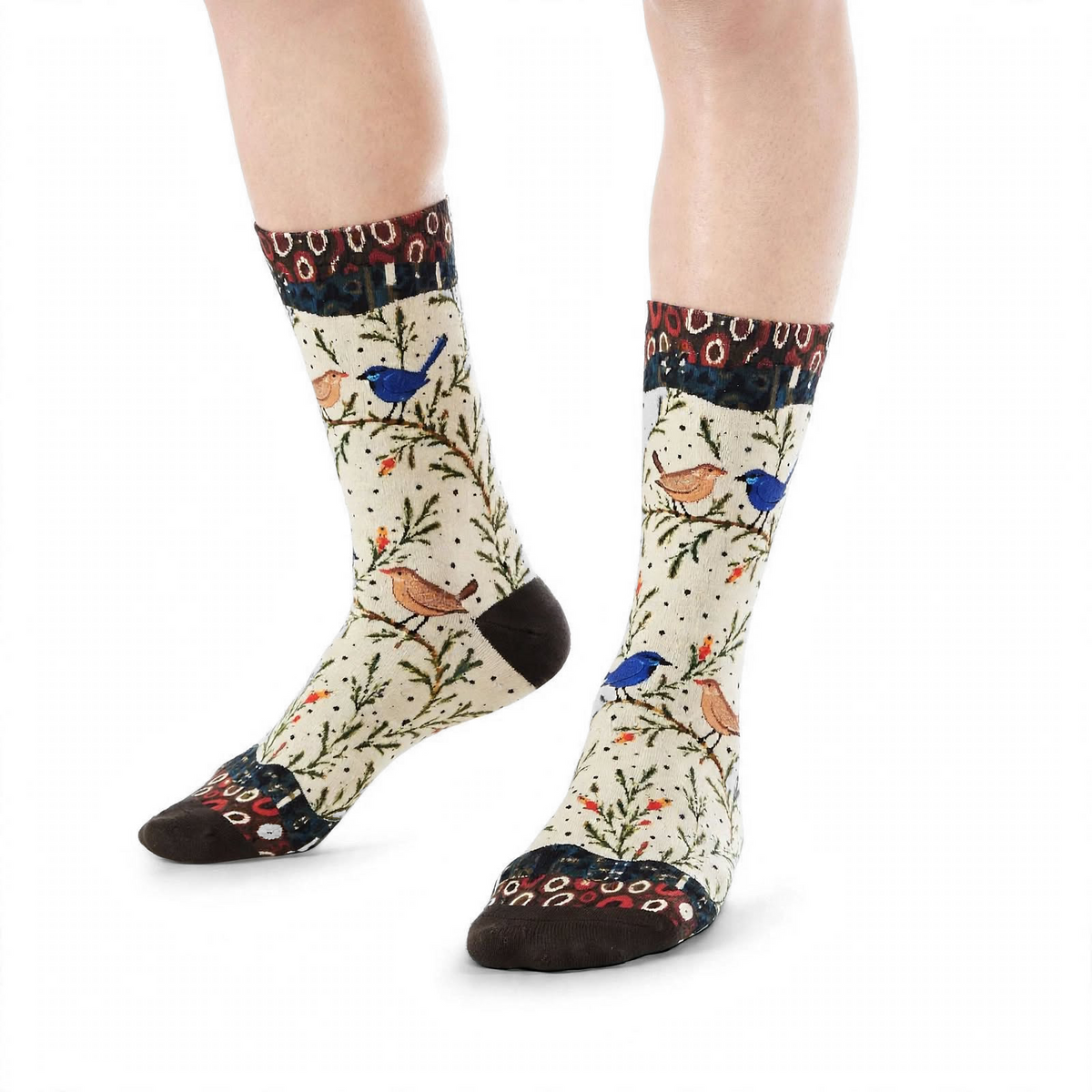 Fairy Wrens by Melanie Hava: cream fairy wren bamboo socks worn on feet, angled front view.