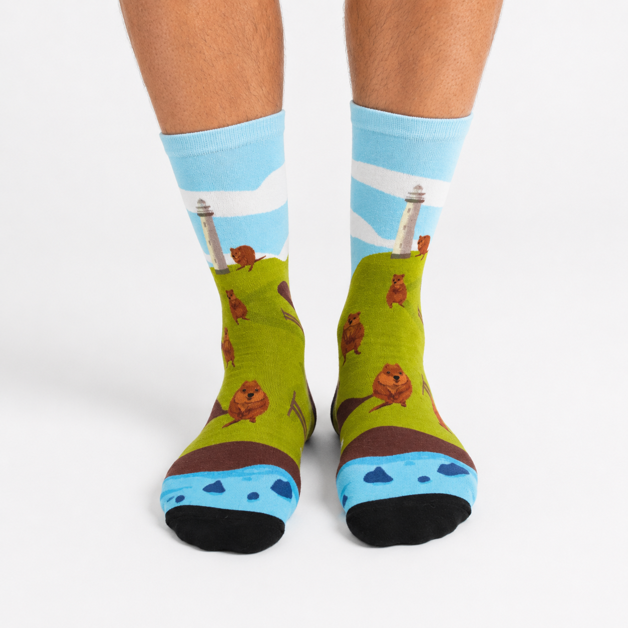 Colourful bamboo socks featuring quokkas at Rottnest Island on a green background.