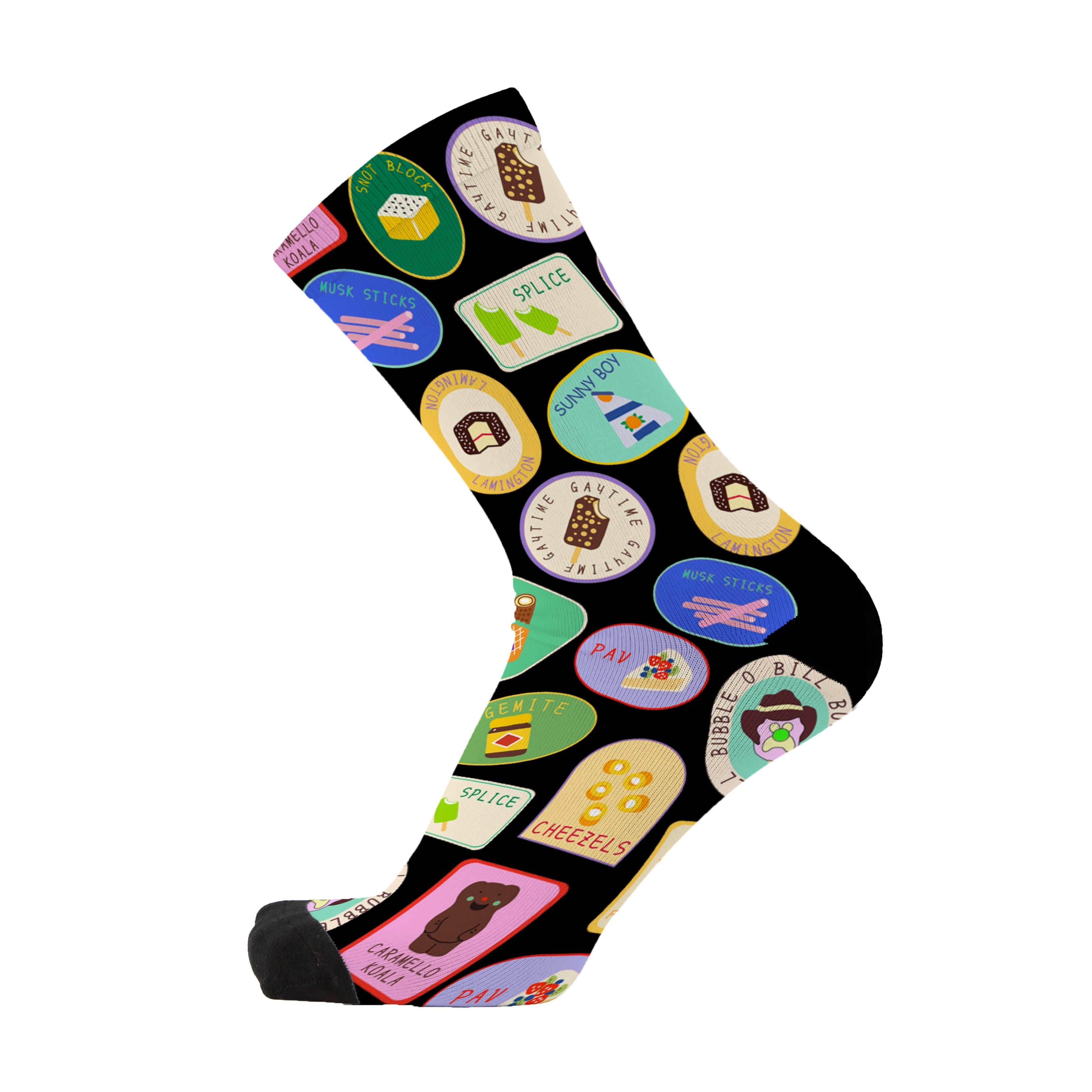 Colourful bamboo socks featuring vegemite, splice, cheezels, lamingtons, golden gaytime, caramello koalas, pavlova, bubble o bill, fairy bread, pies and musk sticks on a black background.