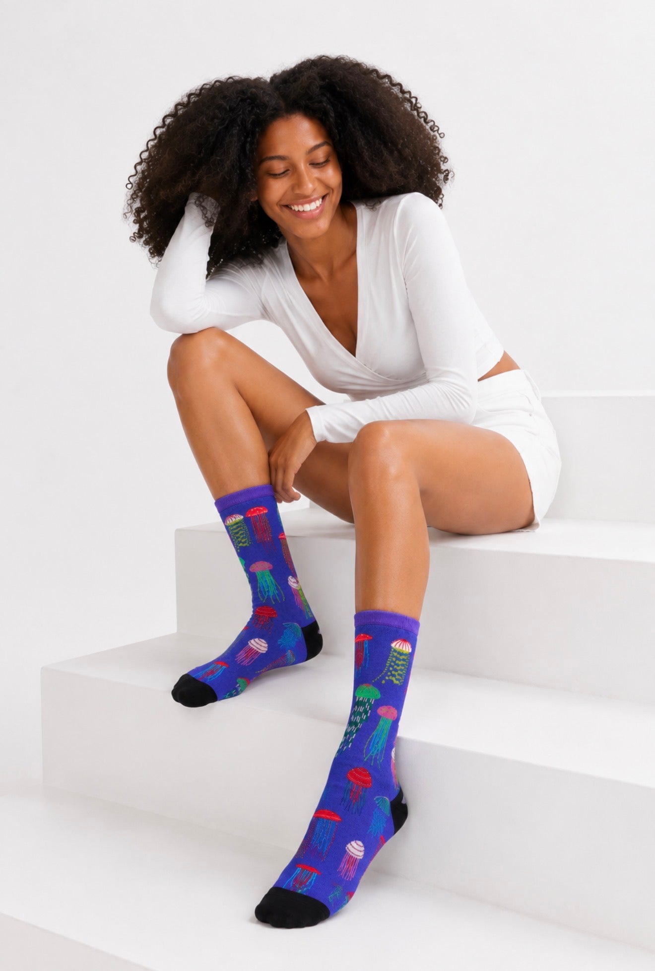 Colourful jellyfish novelty socks with vibrant marine life illustrations on a blue background. Soft cotton-rich crew socks designed in Australia by RedFoxSox.