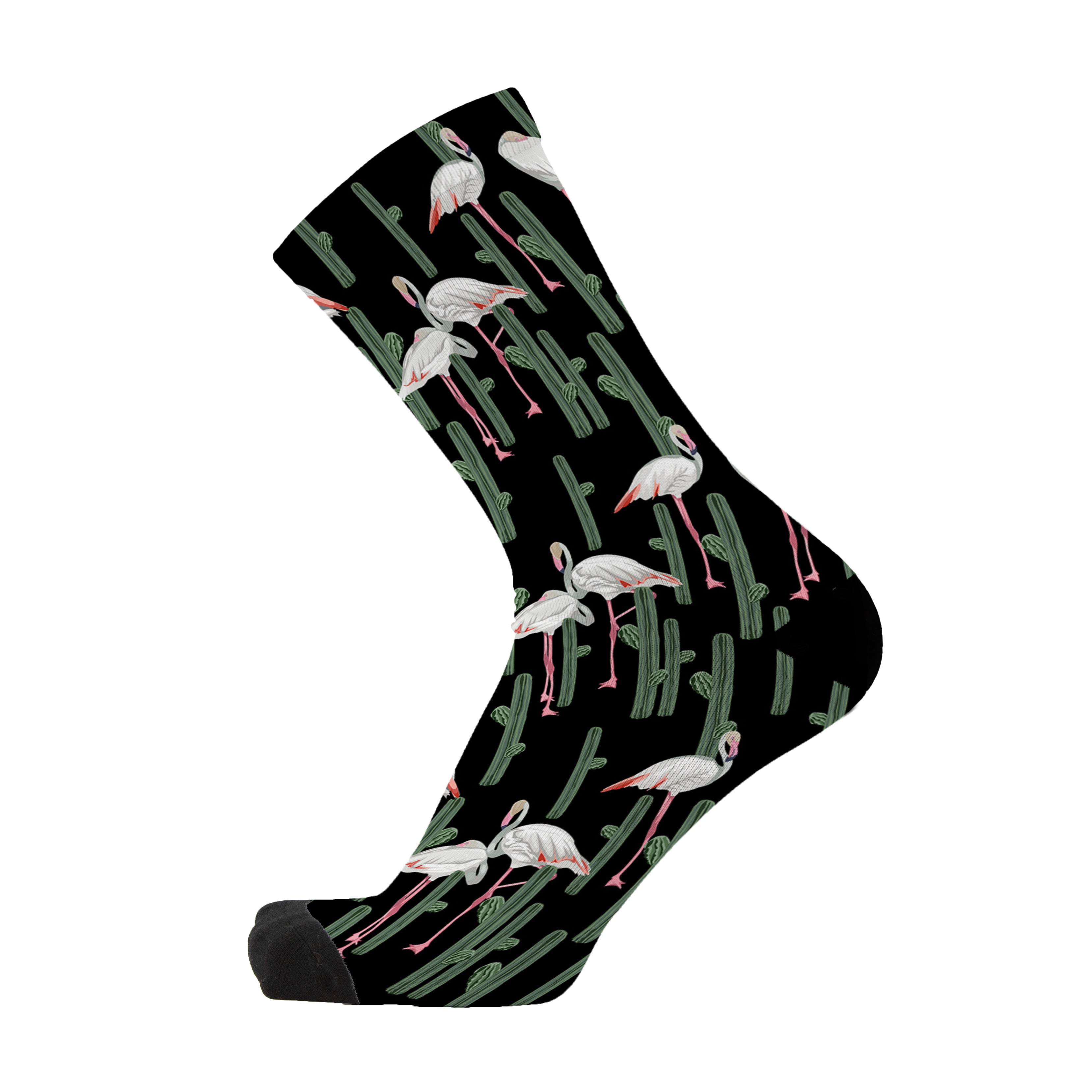 Colourful bamboo socks featuring flamingos and cactus on a black background.