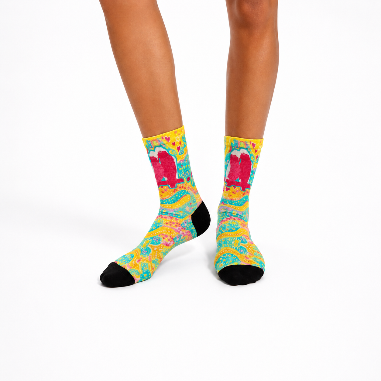Aboriginal design socks worn by a person on a white background