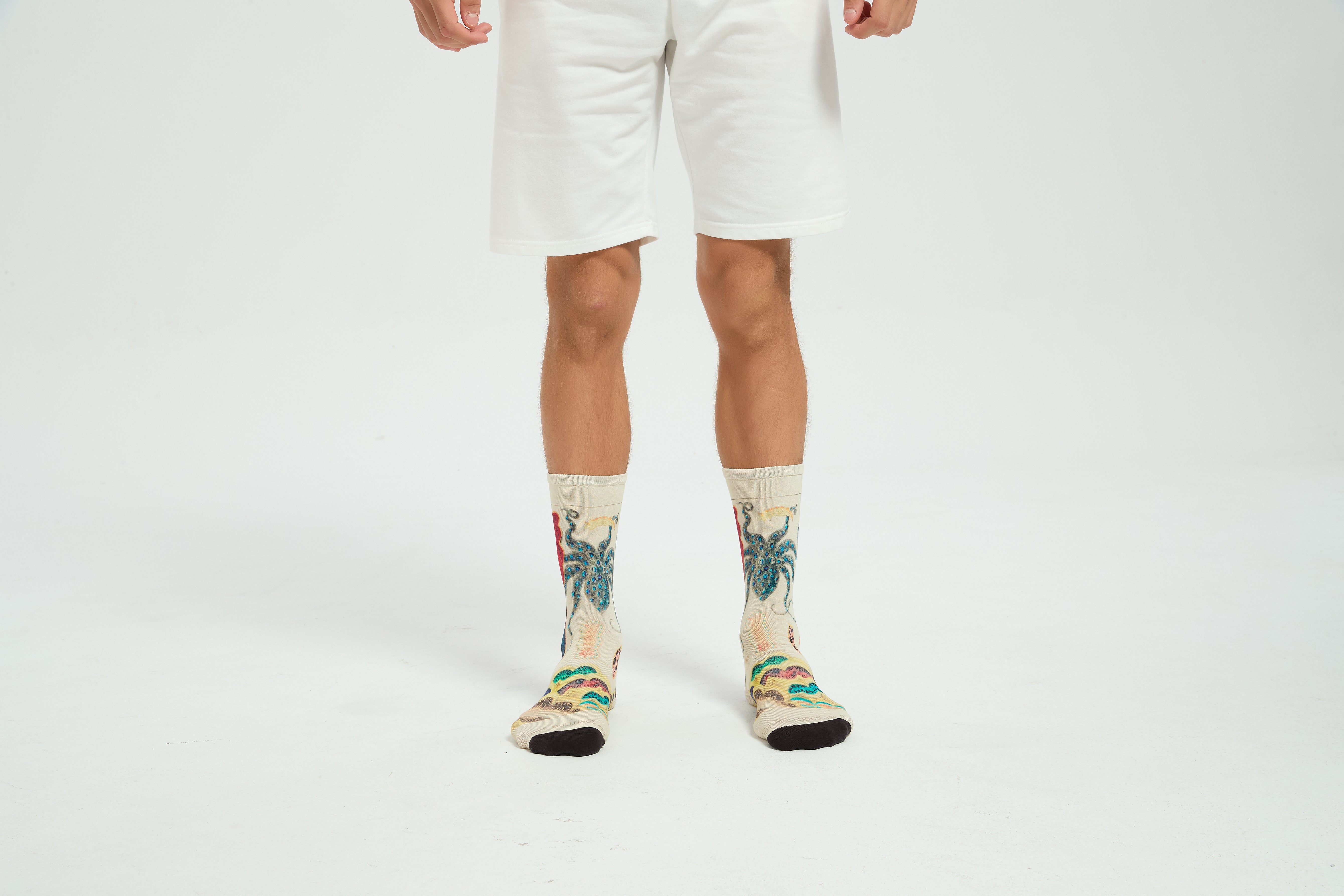 Colourful bamboo socks featuring octopus and ocean animals on a white background.