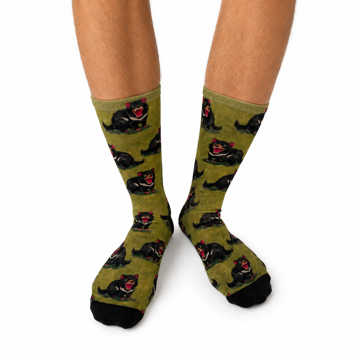 Tasmanian Devil bamboo socks featuring playful black Tasmanian Devils on an olive green background.