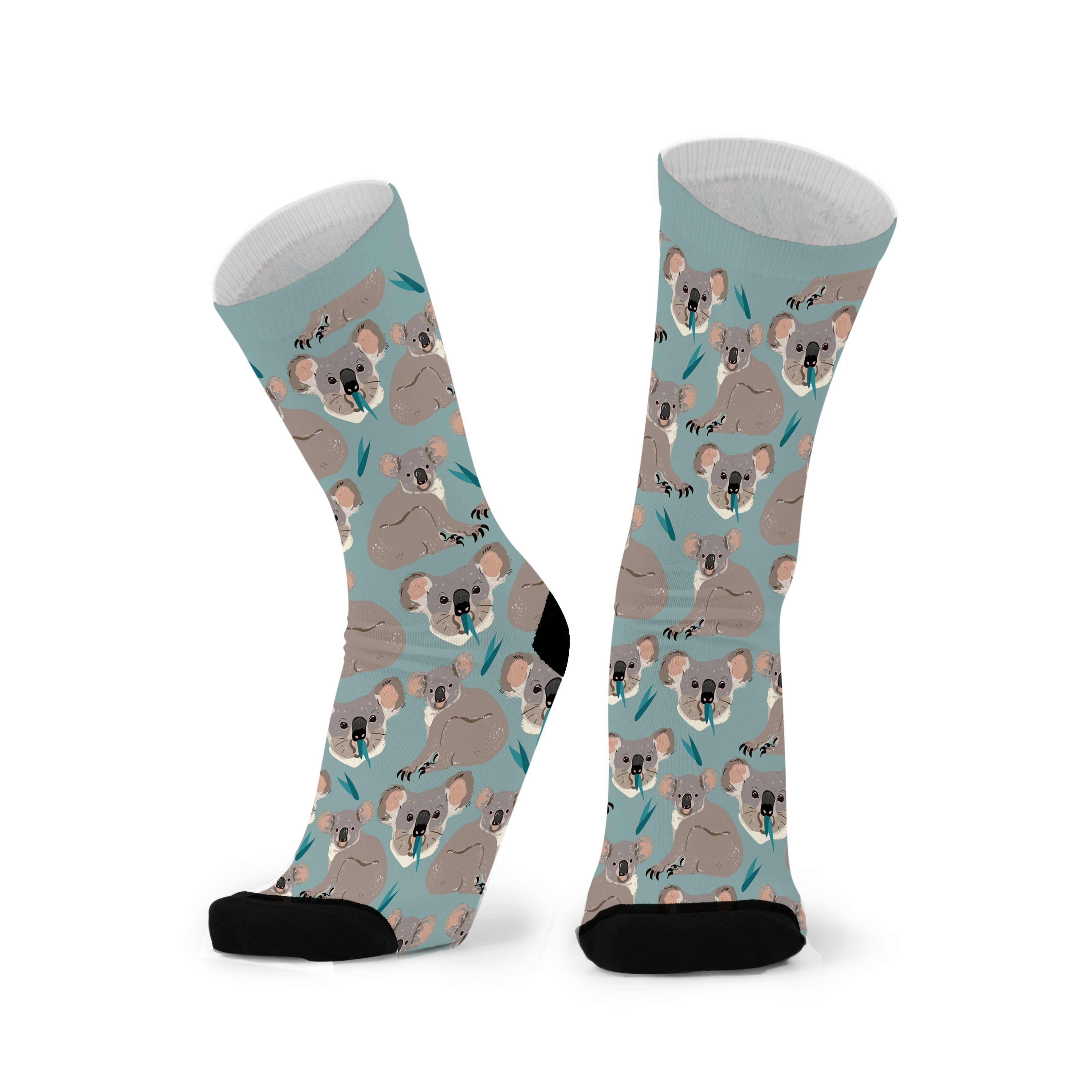 A pair of socks with a pattern of koala faces on a light blue background.