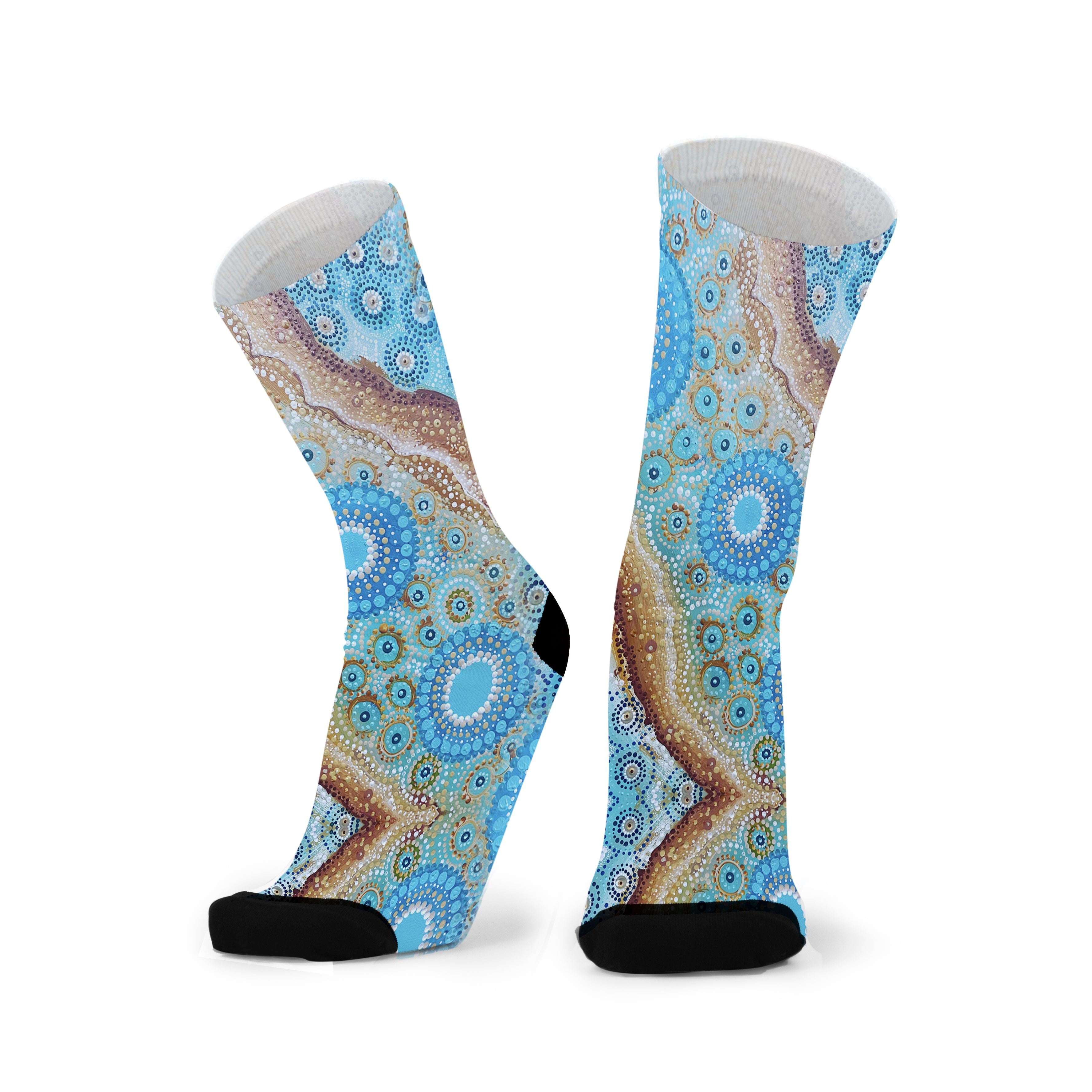 A pair of colorful socks with a geometric aboriginal pattern, designed for big and wide feet, displayed against a white background.