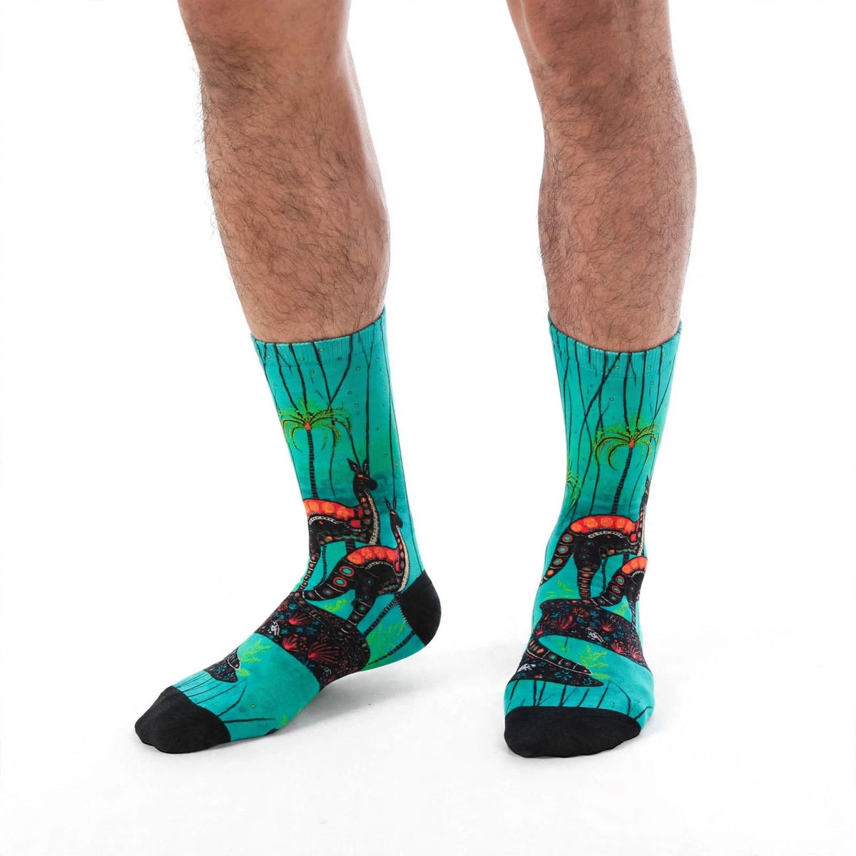 Heart of the Wild by Melanie Hava: turquoise kangaroo-print bamboo socks worn on feet.