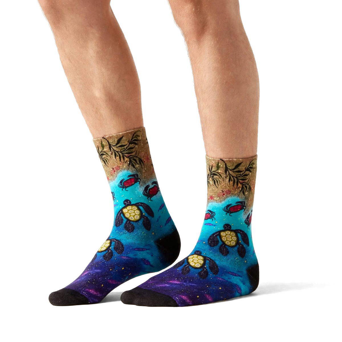 Returning to Shores by Melanie Hava: sea turtle bamboo socks worn on feet, side view.