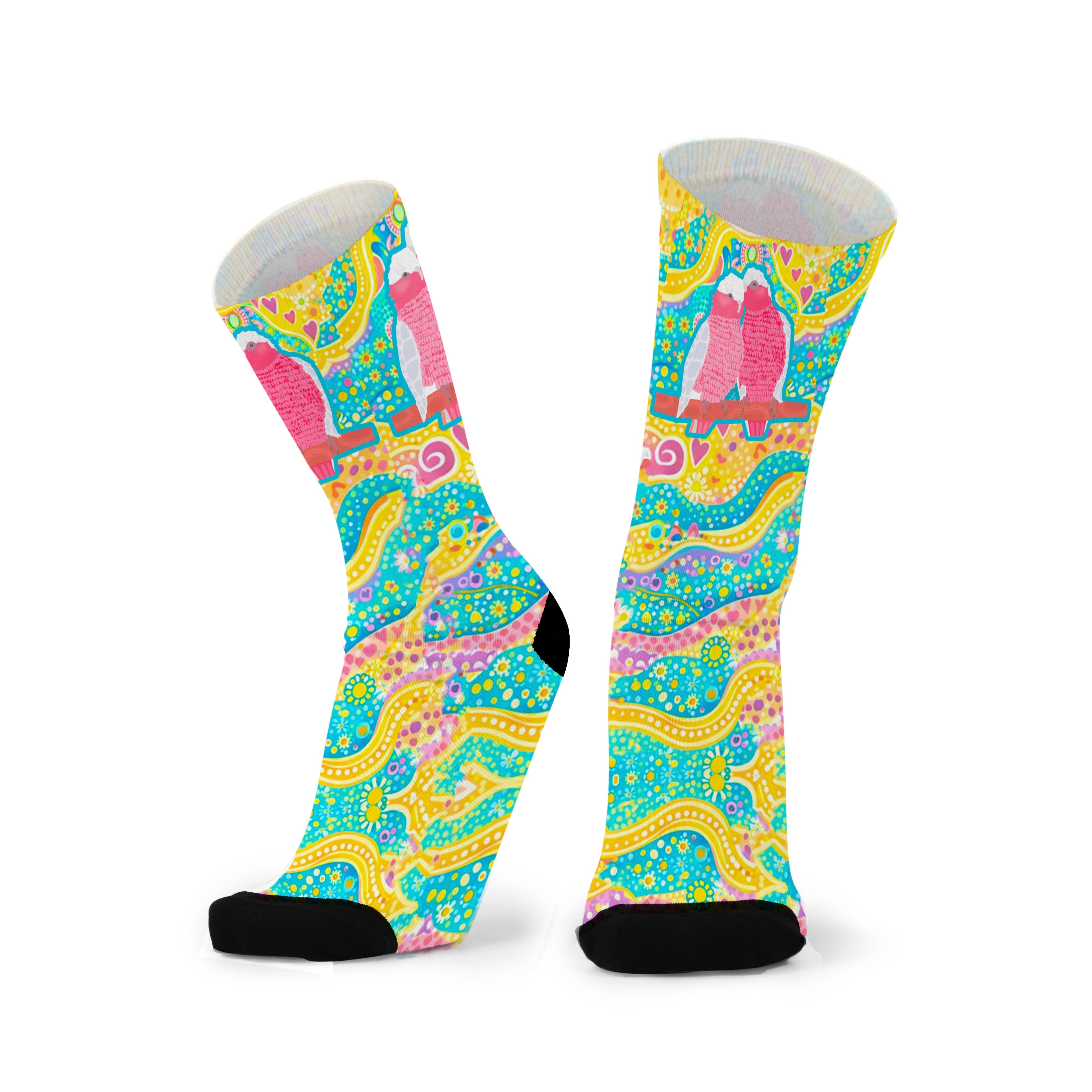 Colorful aboriginal design socks with a pattern on a white background
