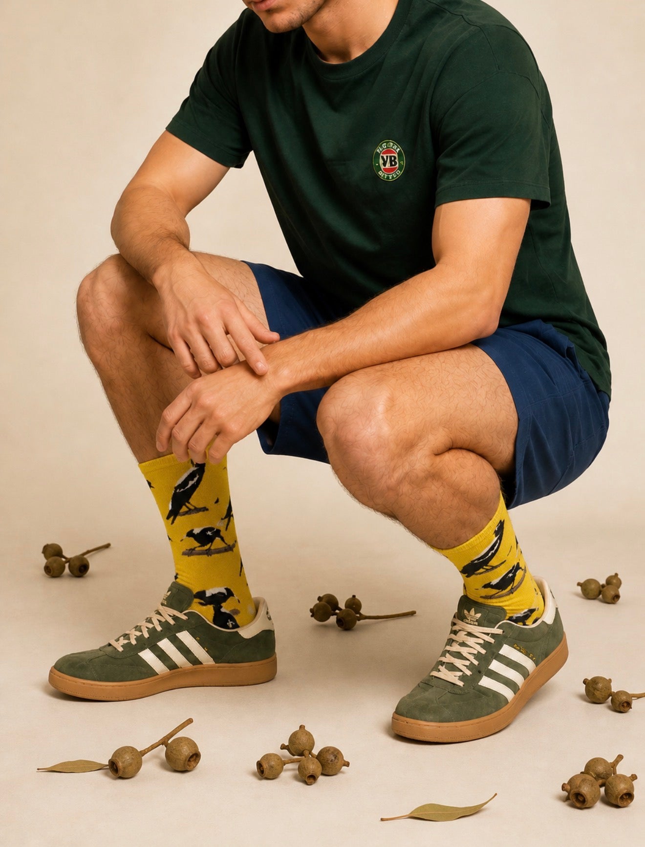 Australian Magpie bamboo socks featuring black and white native Australian magpies on a golden yellow background.