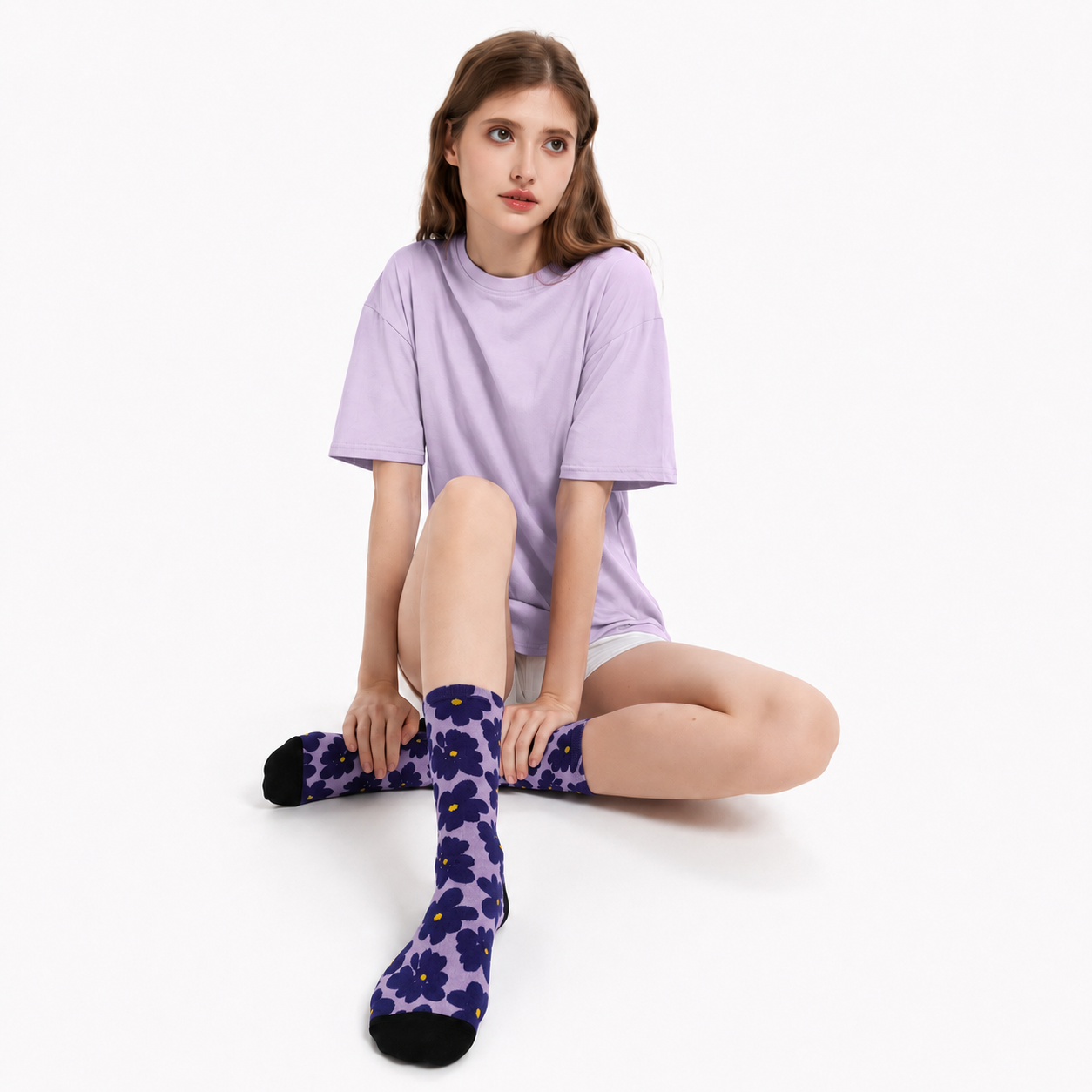 Purple floral bamboo socks with bold navy flowers on a lavender background, perfect for everyday wear, gifts and nature lovers.