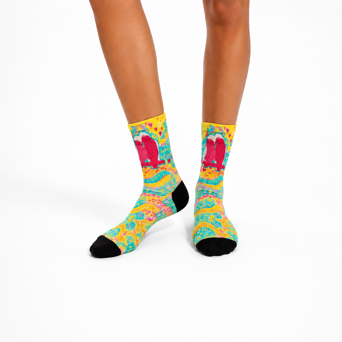 Aboriginal design socks worn by a person on a white background