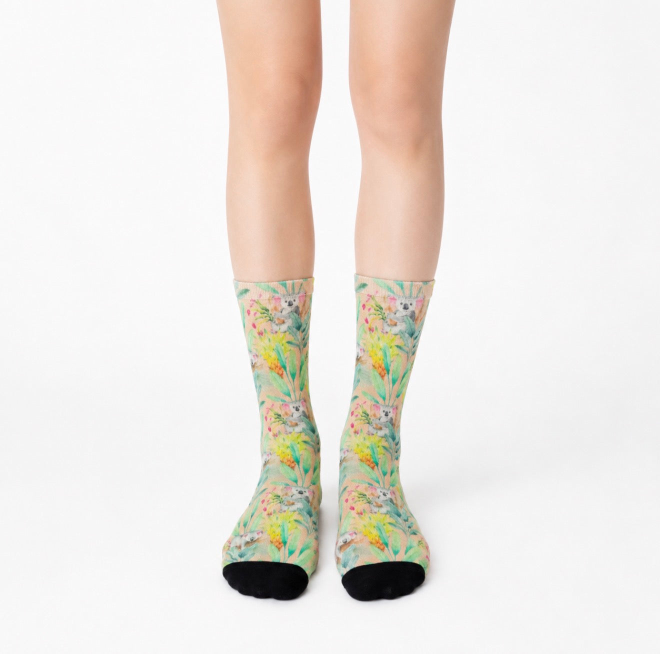 Colorful koala patterned socks on a white background