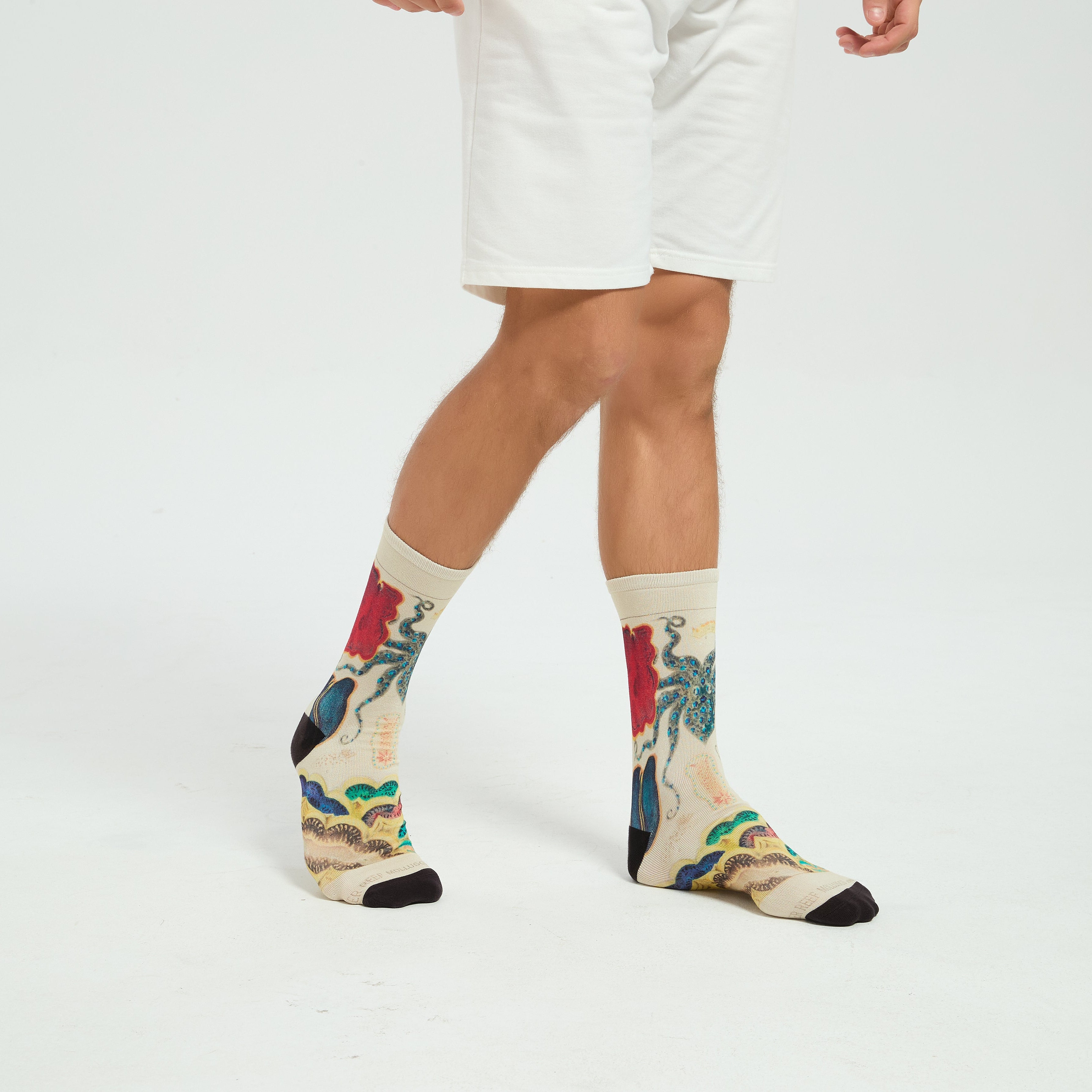 Colourful bamboo socks featuring octopus and ocean animals on a white background.