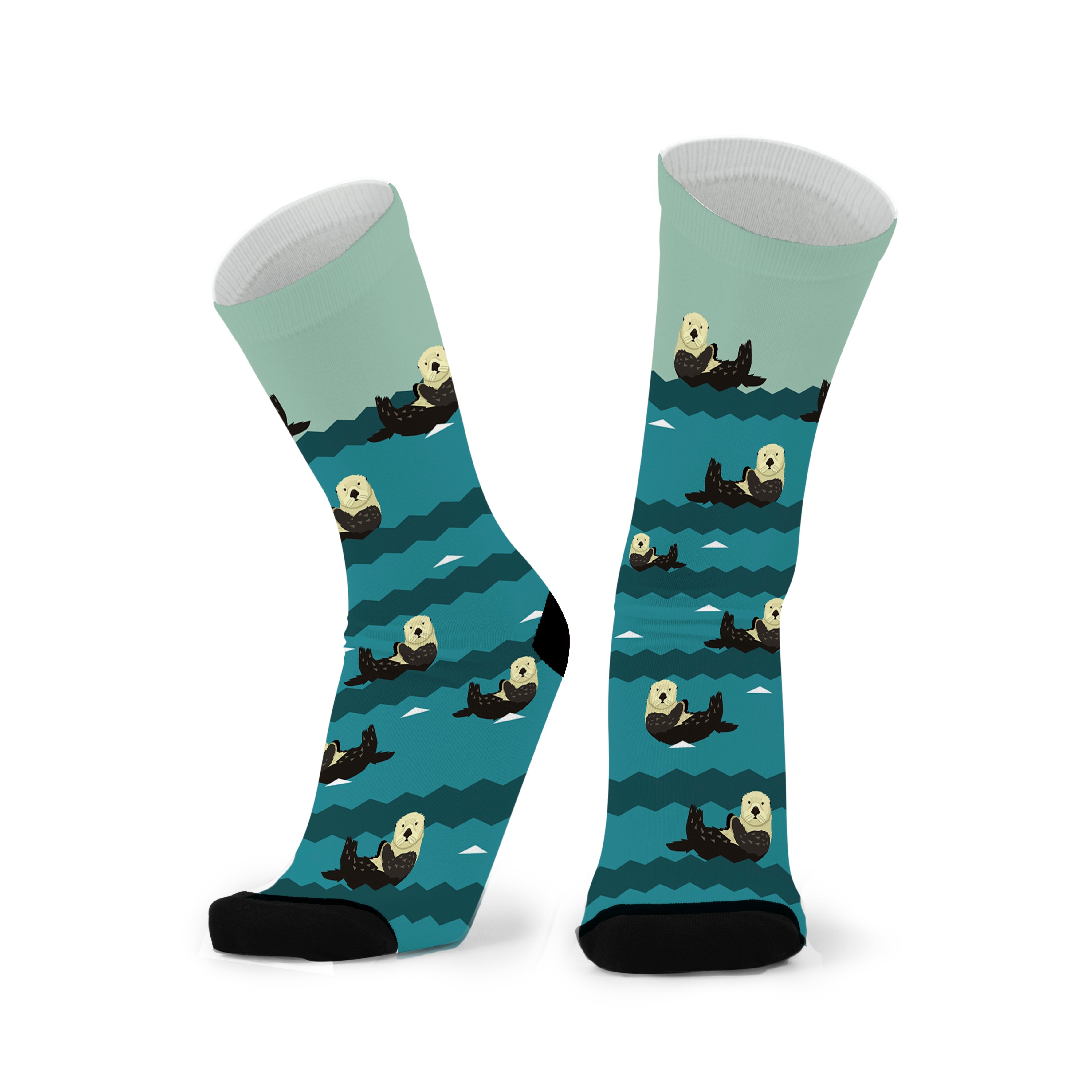 A pair of socks with a pattern of otters in various swimming poses on a teal background.