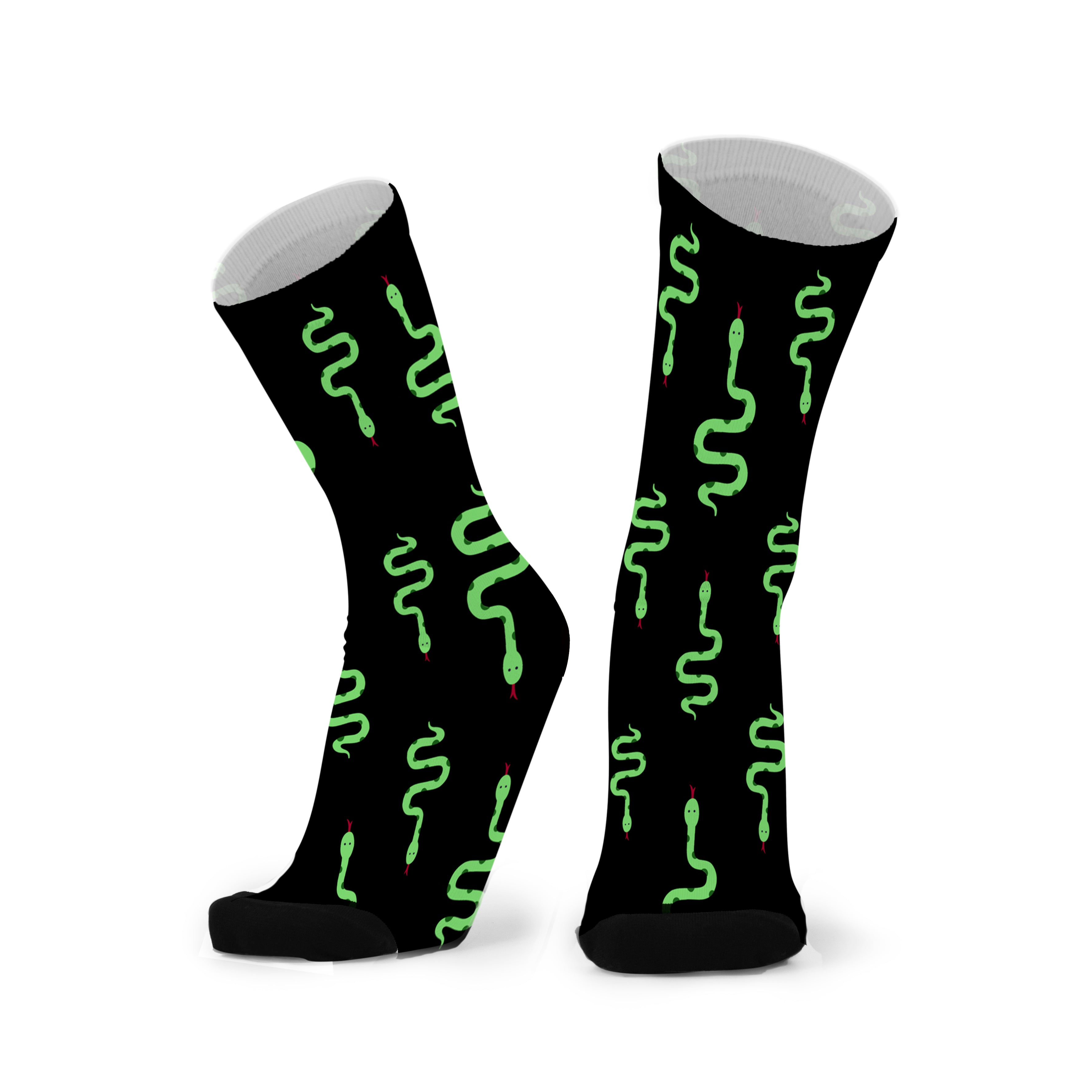 A pair of black socks with a green serpentine pattern, featuring a seamless toe design.