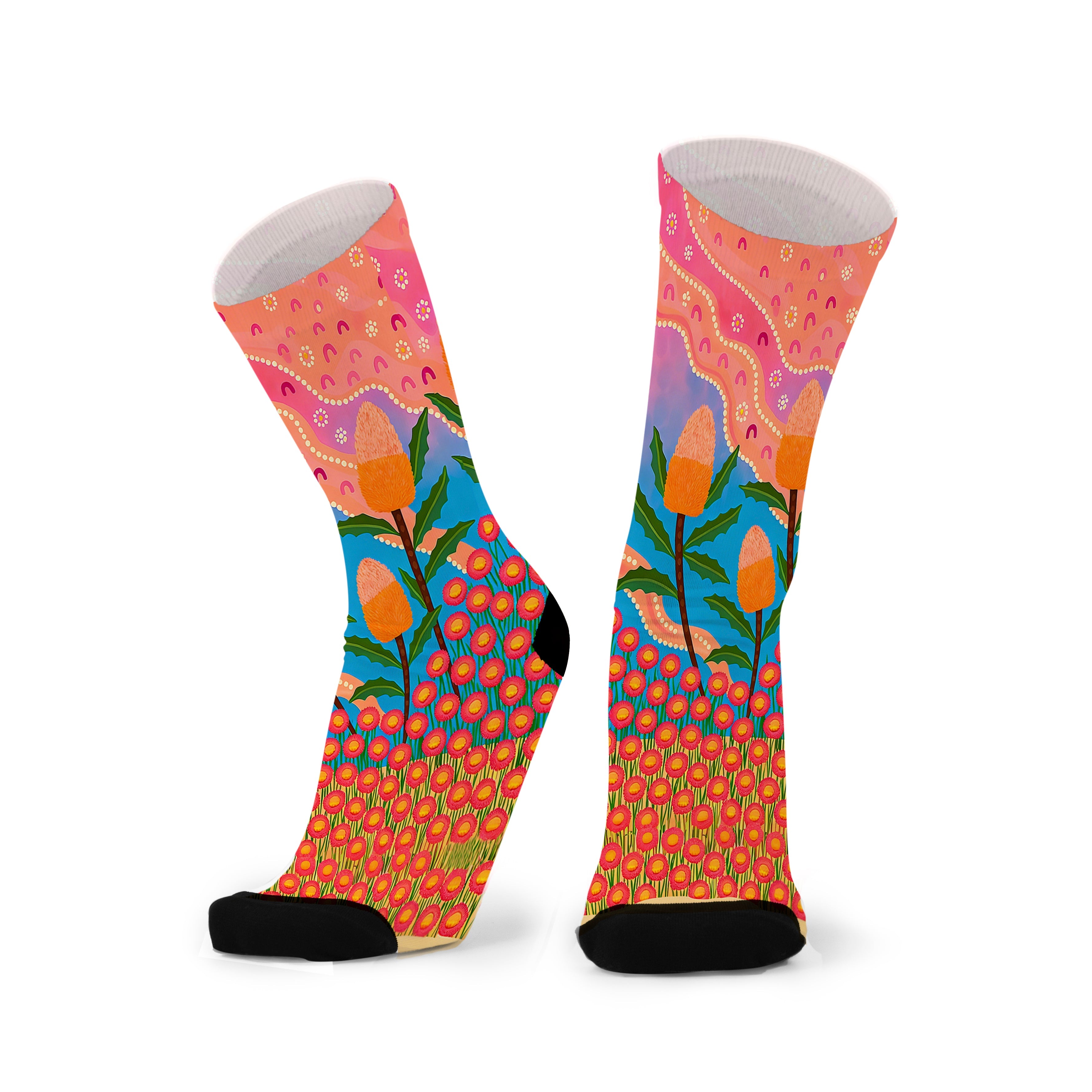 Colorful socks with aboriginal design on a white background