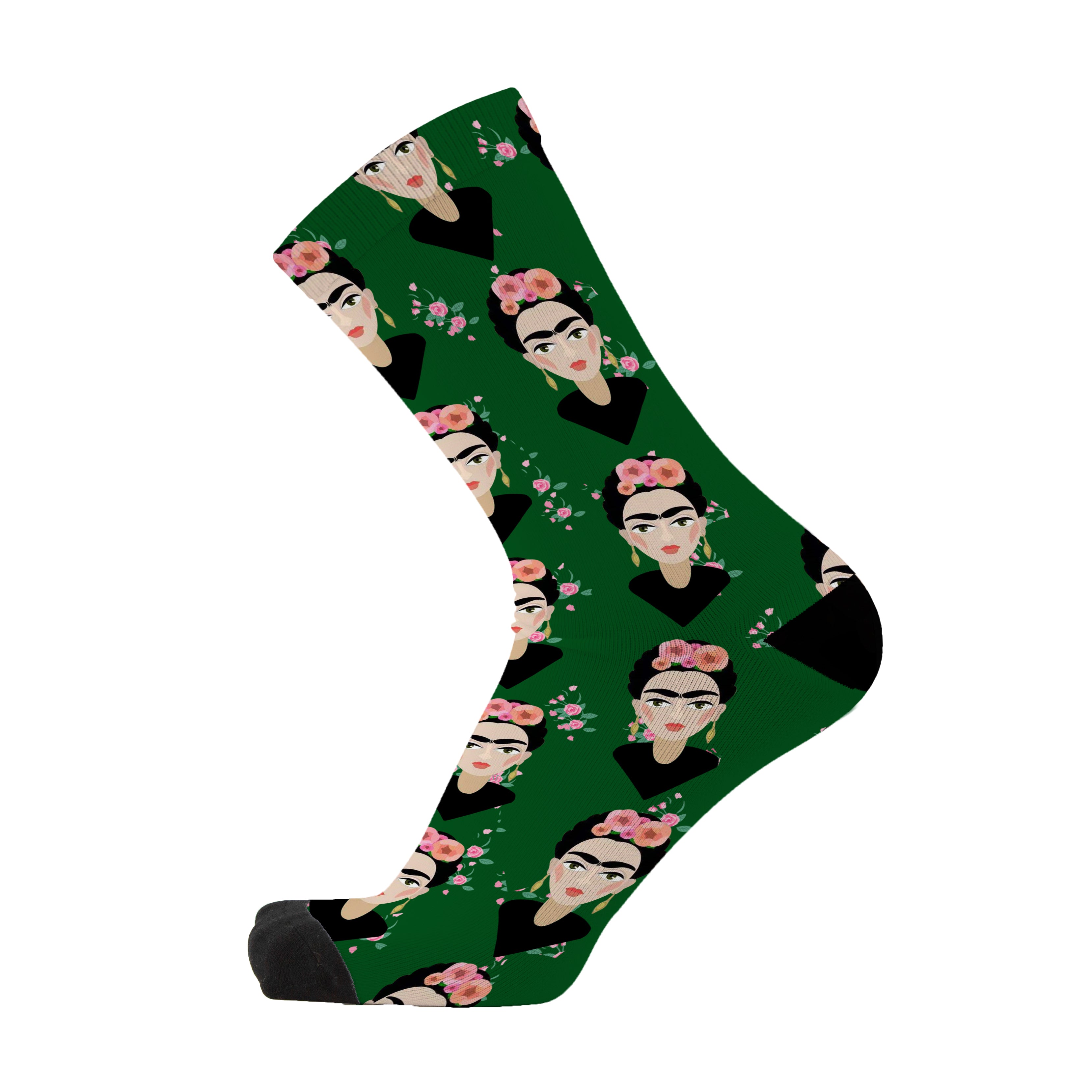 A green sock with a repeated pattern of a woman's face Frida in black and pink, representing the product 'Señorita' socks.